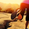 fitness woman legs running on desert trail